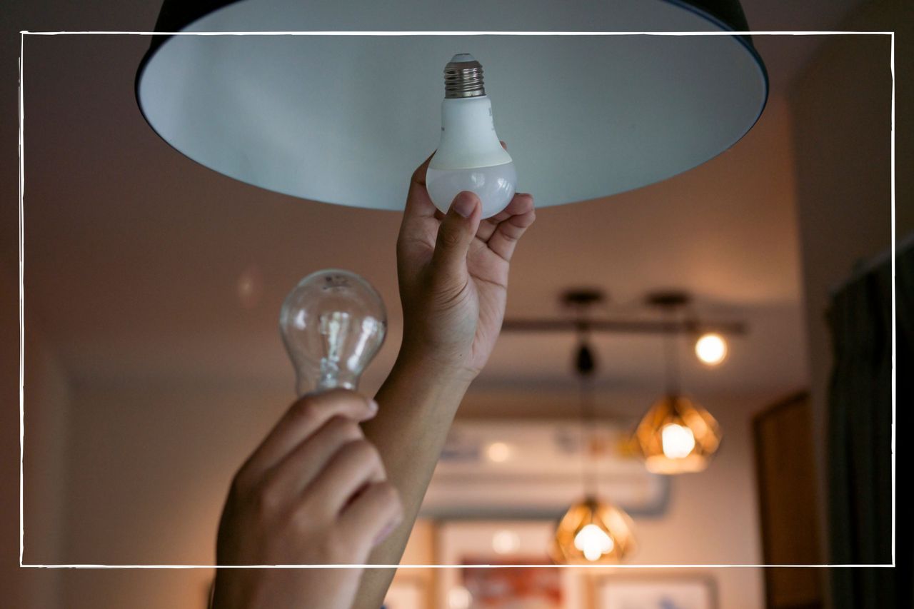 hands changing a lightbulb from old halogen one to LED alternative