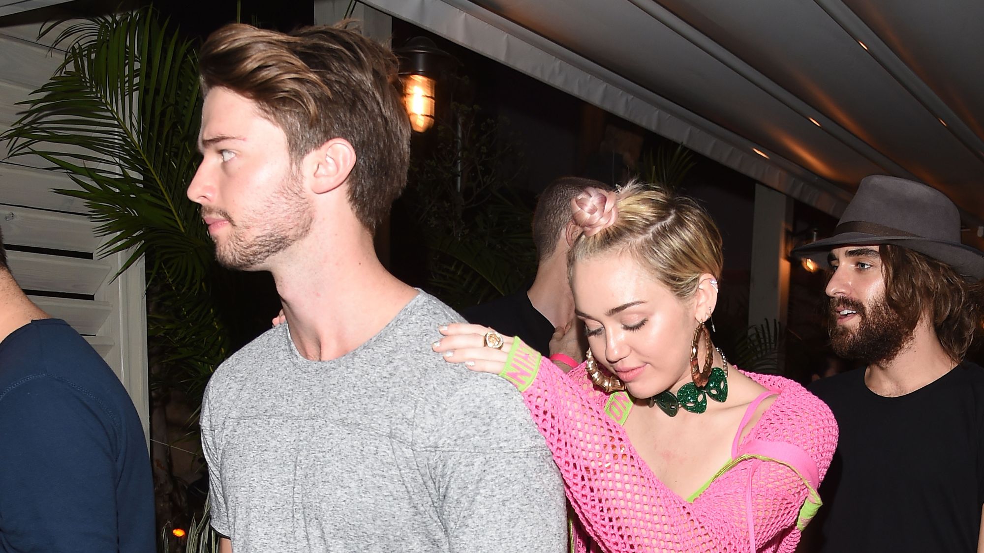 Patrick Schwarzenegger and Miley Cyrus attend the Jeremy Scott & Moschino party in 2014
