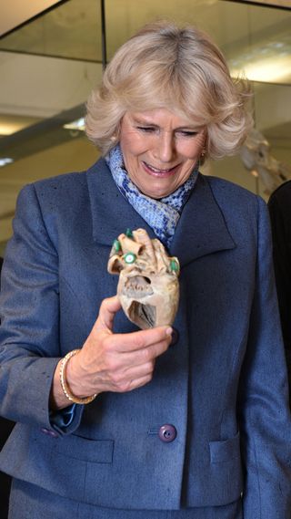 Camilla holding a fake dog's heart.