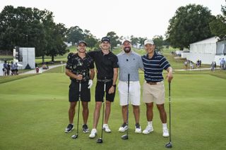 Four golfers pose for a photo during the Creator Classic