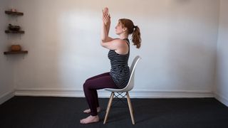 desk exercises: woman demonstrating 'eagle' hand pose