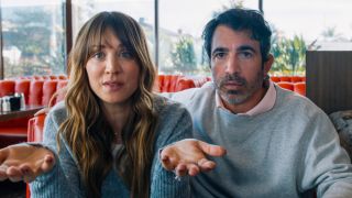 Kaley Cuoco and Chris Messina sitting in a diner with expressive faces in Based on a True Story.