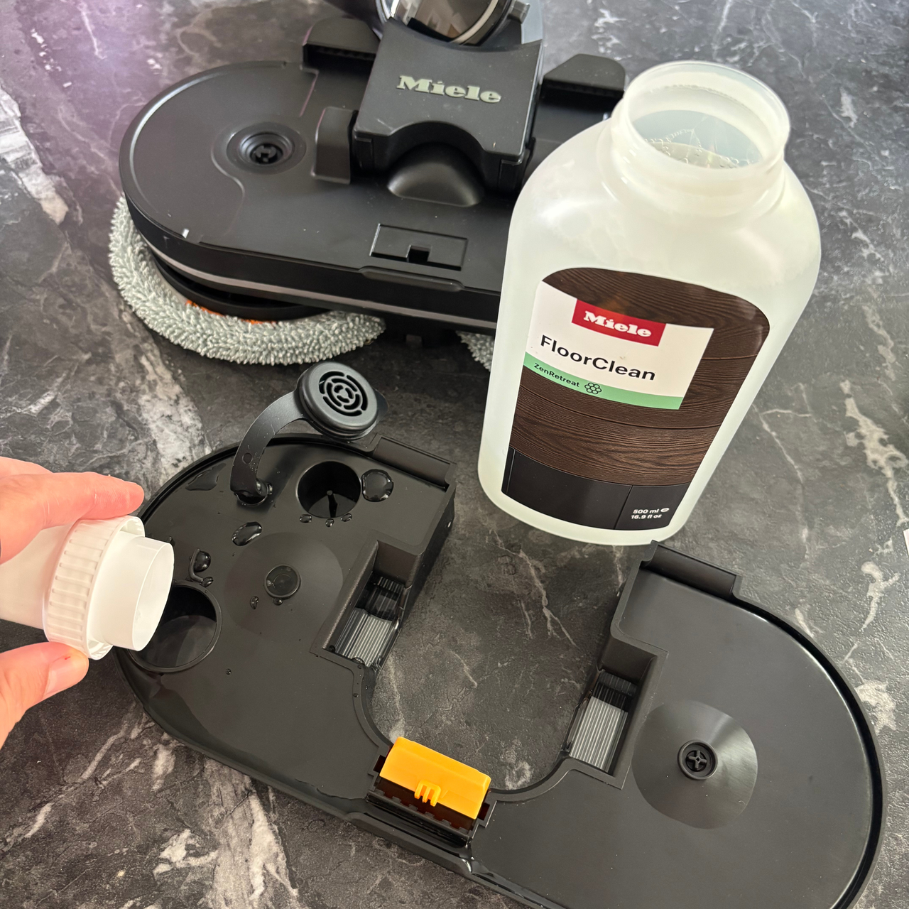 Miele Triflex HX3 Aqua filling the mop water container