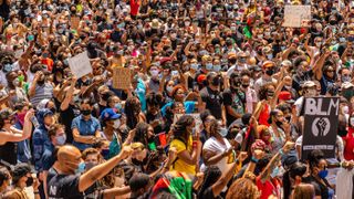 Large crowds protest police brutality and the killing of George Floyd by police. The Black Lives Matter protest, seen here on June 19, 2020, in downtown Chicago, is just one of thousands across the U.S. and globe.