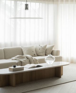 A minimalist living room in a neutral color scheme