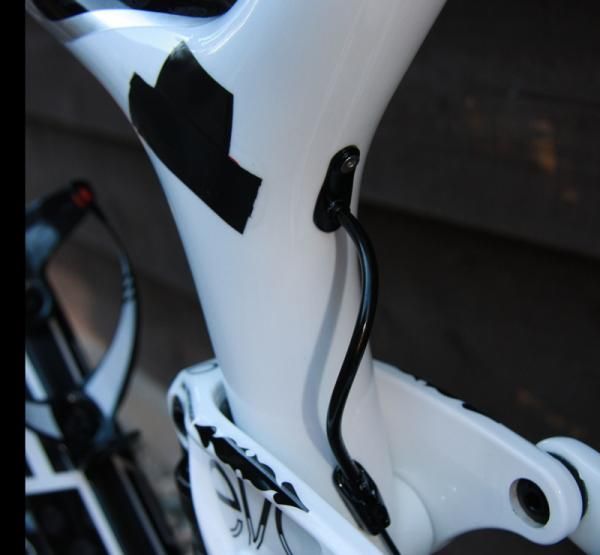 The taped over logo and internal cable exit point.