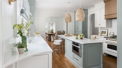 A blue and white kitchen with mitered countertop edges