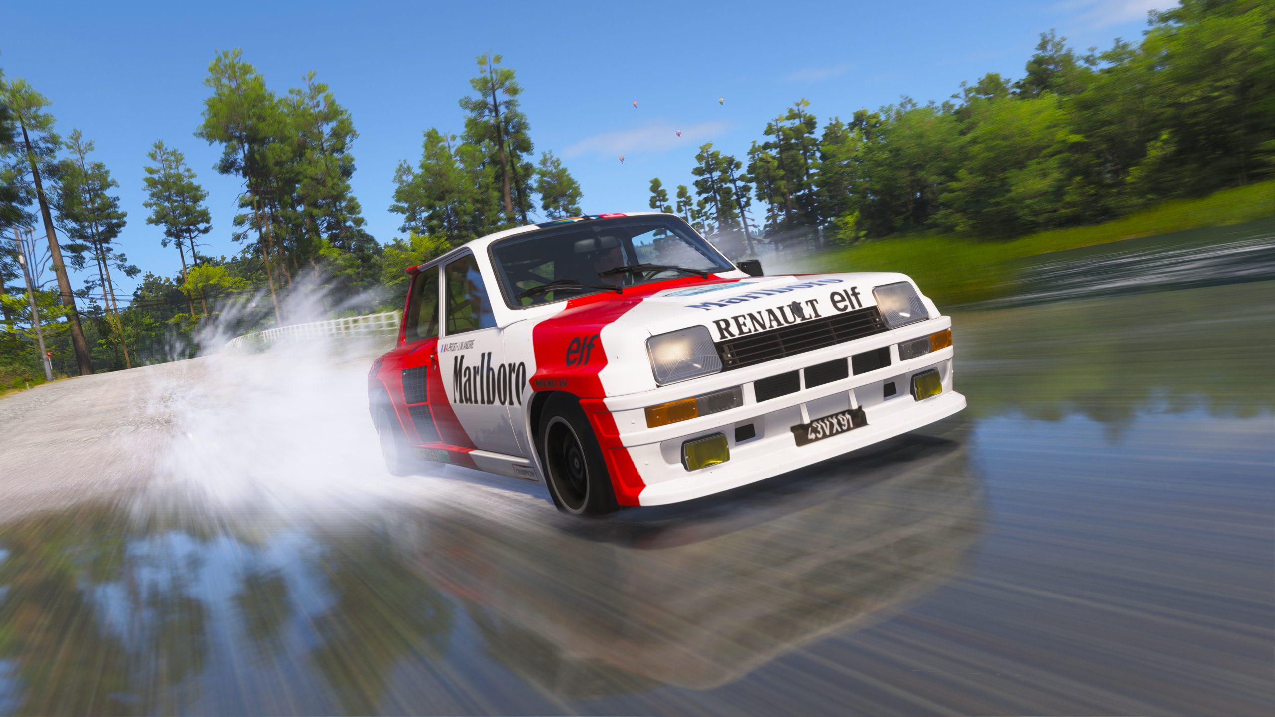Forza Horizon 6 best cars: A front-side view of the Renault 5 Turbo racing through a river.