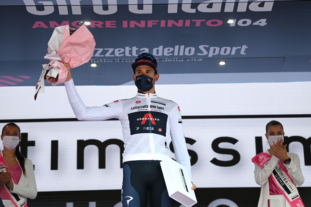 CANALE ITALY MAY 10 Filippo Ganna of Italy and Team INEOS Grenadiers white best young jersey celebrates at podium during the 104th Giro dItalia 2021 Stage 3 a 190km stage from Biella to Canale girodiitalia Giro on May 10 2021 in Canale Italy Photo by Stuart FranklinGetty Images