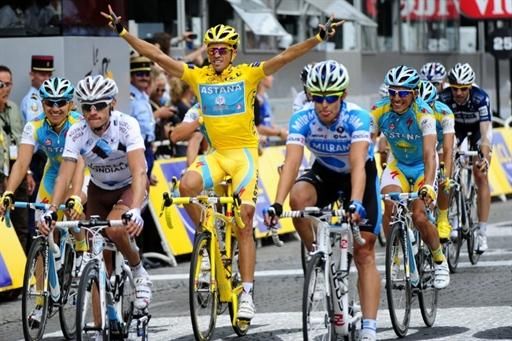 Alberto Contador (Astana) crosses the finish line in Paris to win his third Tour de France.