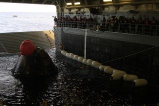 NASA’s Orion spacecraft is pulled into the well deck of the U.S. Navy’s USS Anchorage after its splashdown in the Pacific Ocean on Dec. 5. 2014. Orion successfully completed its first-ever test flight that day, an unmanned effort called Exploration Flight