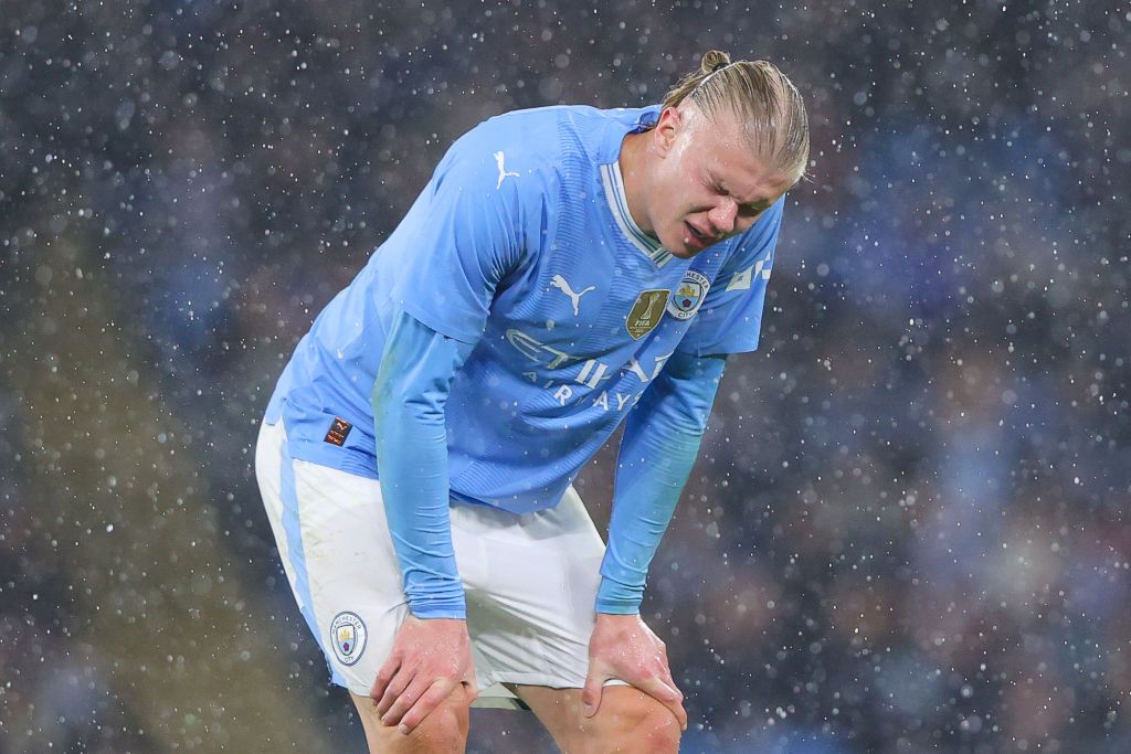 Erling Haaland of Manchester City reacts after a heavy challenge during the Emirates FA Cup Quarter Final match between Manchester City and Newcastle United at Etihad Stadium on March 16, 2024 in Manchester, England.