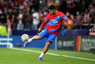 Atletico Madrid’s Luis Suarez warms up with the ball prior to the UEFA Champions