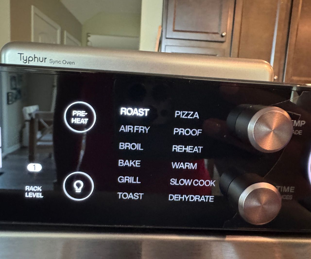 A close up of the digital LED screen on the front of the Typhur Sync air fryer oven