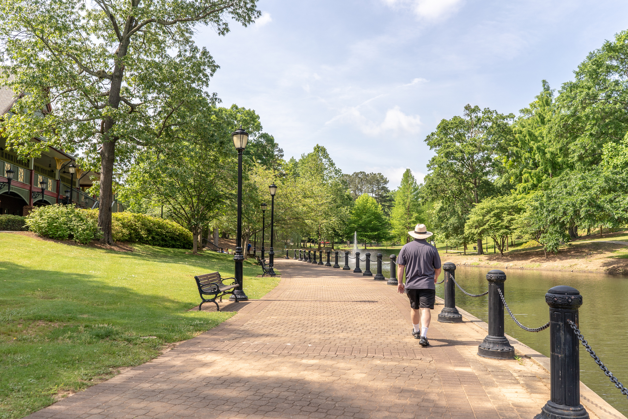 Spartanburg, S.C. / USA - May 4, 2019: A young man explores the beautiful Cleveland Park, a newly rebuilt park in Spartanburg County.