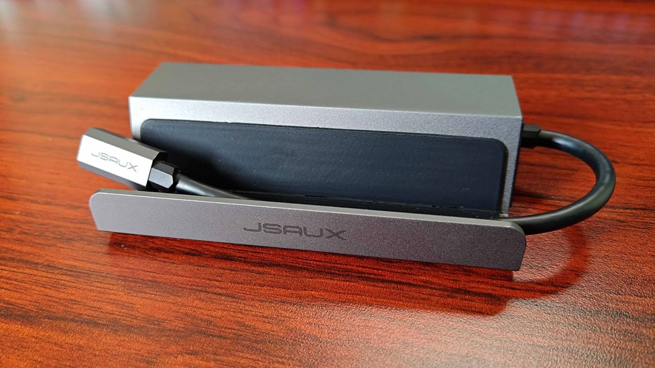 Front Jsaux 5-in-1- Steam Deck dock with logo and USB-C cable in view.