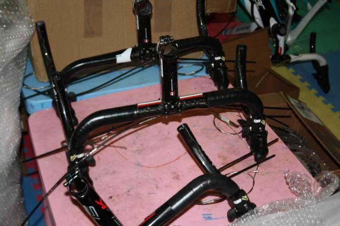 A production line of handlebars awaits attention