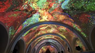 The immersive experience at Church of San Miguel projecting vivid imagery on the church's ceilings. 