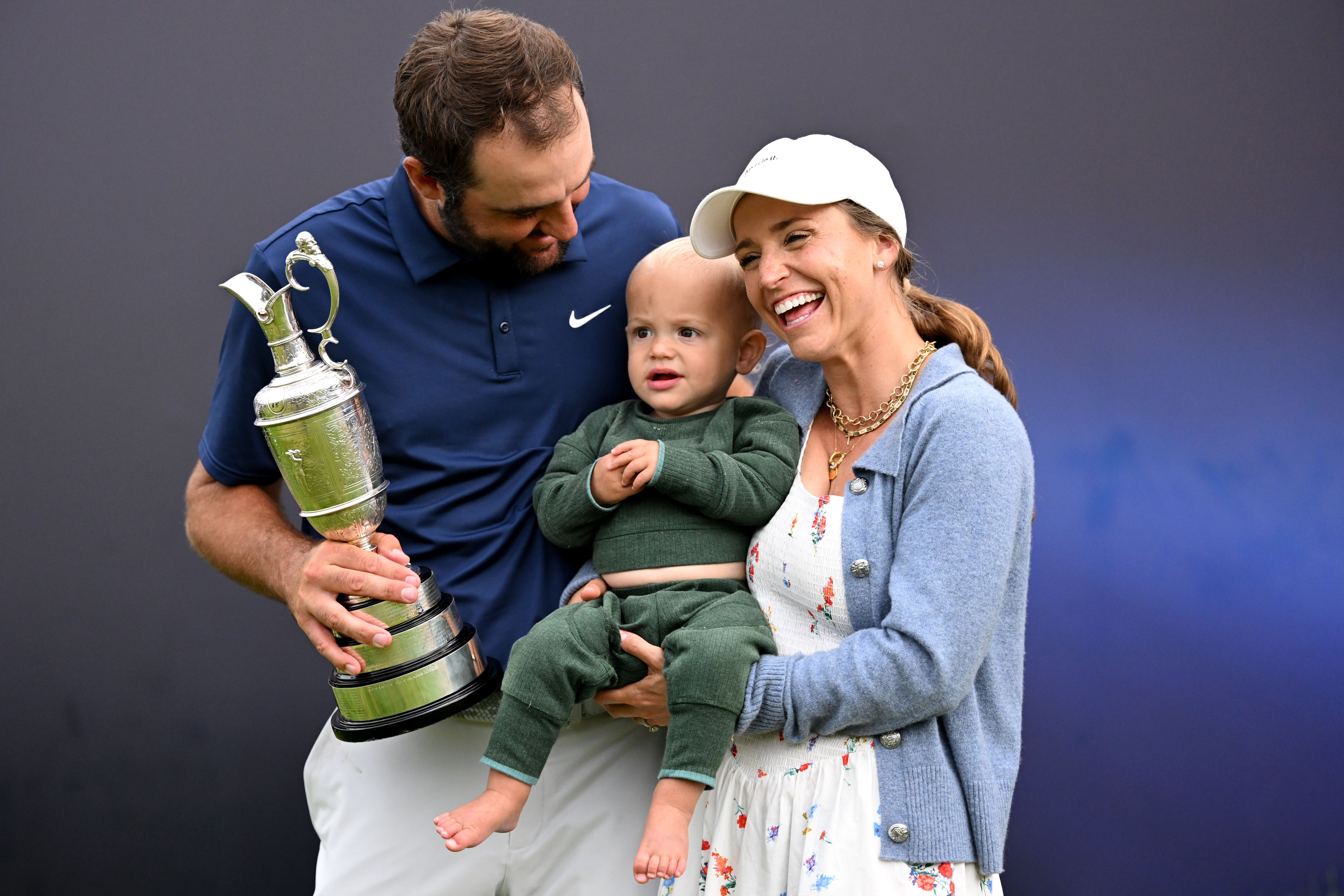 Scottie Scheffler and his family celebrate with the Claret Jug
