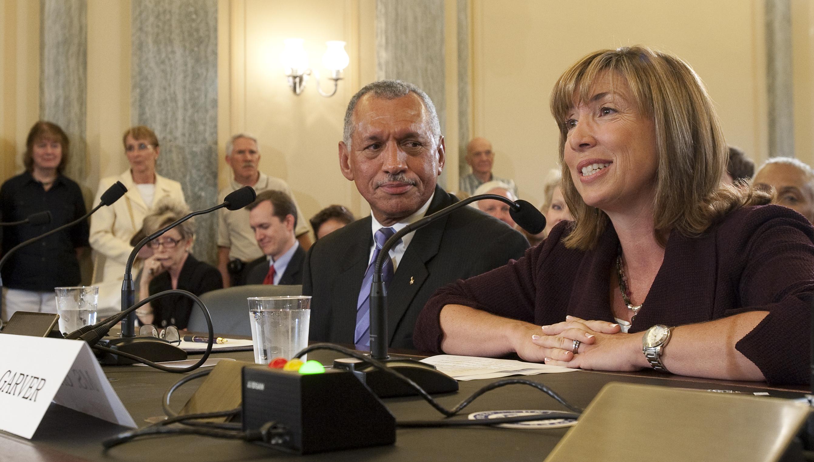 Lori Garver smiles while speaking to lawmakers during Senate confirmation hearings in 2009.