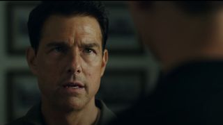 Tom Cruise looking at Miles Teller in Top Gun: Maverick