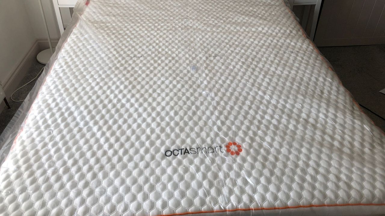 The Octasmart Deluxe Topper still wrapped in its plastic packaging