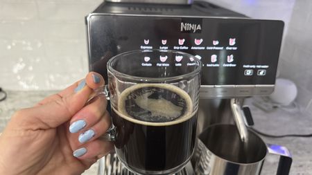 Ninja AutoBarista Pro and cup of coffee close up