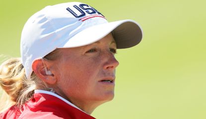 Stacy Lewis looks on whilst wearing a USA cap
