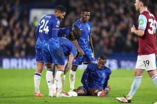 Nicolas Jackson of Chelsea winces after pulling a muscle in his thigh during the Premier League match between Chelsea FC and West Ham United FC at Stamford Bridge on February 3, 2025 in London, England