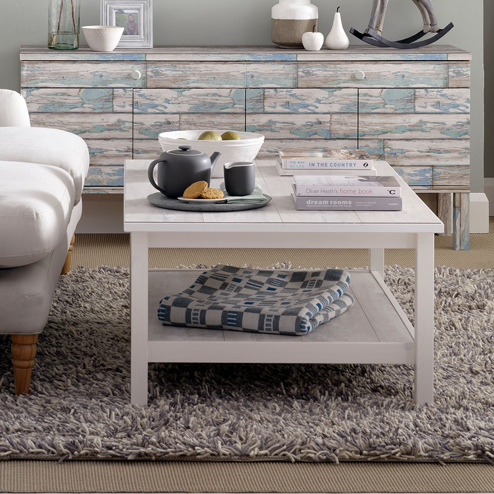 living room with coffee table and carpet floor