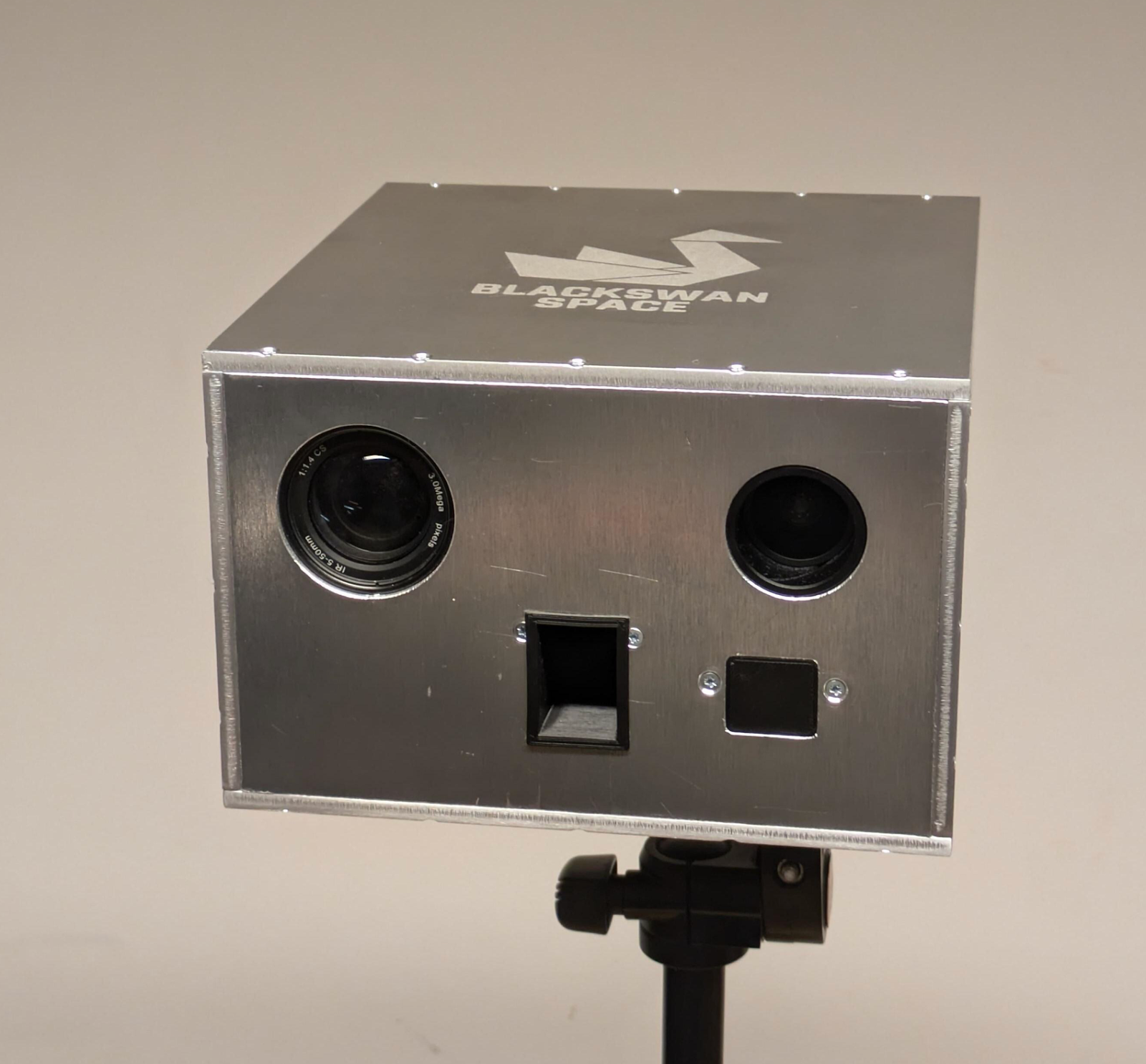 A metal box with two circle cutouts and two rectangle cutouts.