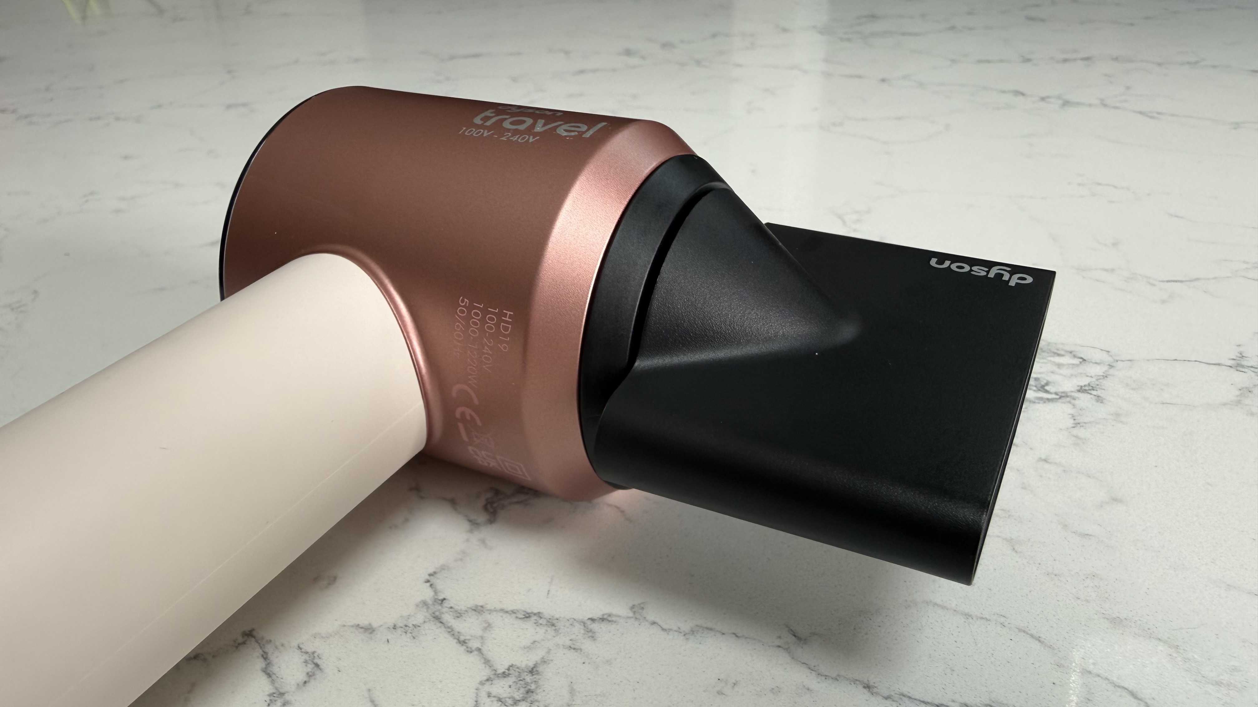 Side view of the Dyson Supersonic Travel with styling concentrator attachment attached