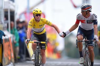 Mark Cavendish (Dimension Data) shakes hands with Reto Hollenstein ( IAM Cycling) at the end of stage two of the 2016 Tour de France