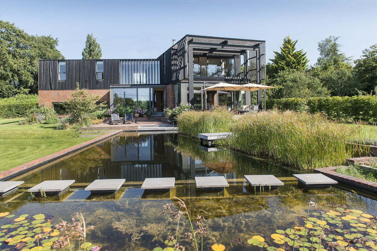 modern self build with brick and black timber cladding