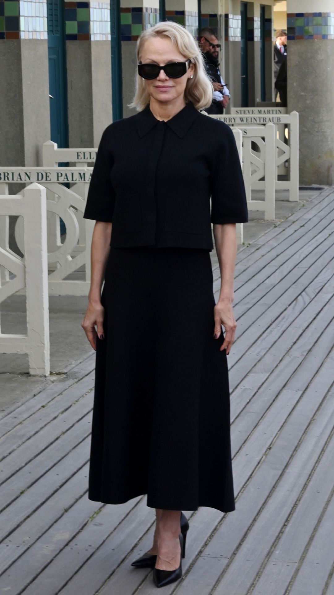 pamela anderson wearing an all-black outfit