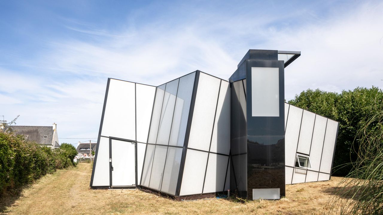 Maison de Verre, an angular white glass house in France by Studio Odile Decq