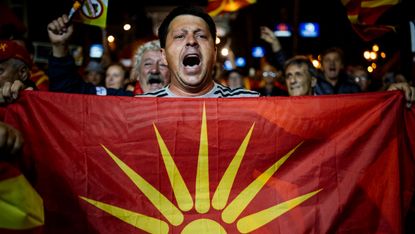 A boycott supporter takes to the streets in Skopje to celebrate the low turnout