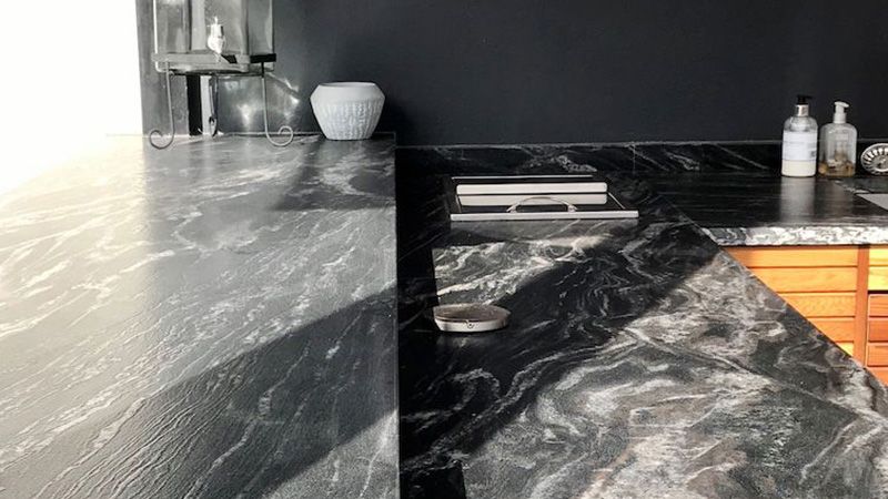 Outdoor kitchen work top made from black veined marble