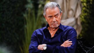 Eric Braeden as Victor Newman with his arms crossed in The Young and the Restless