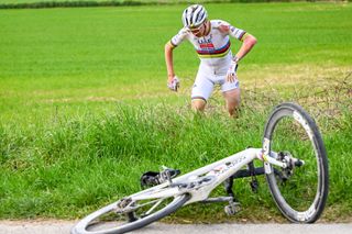 Tadej Pogačar in a ditch at Strade Bianche