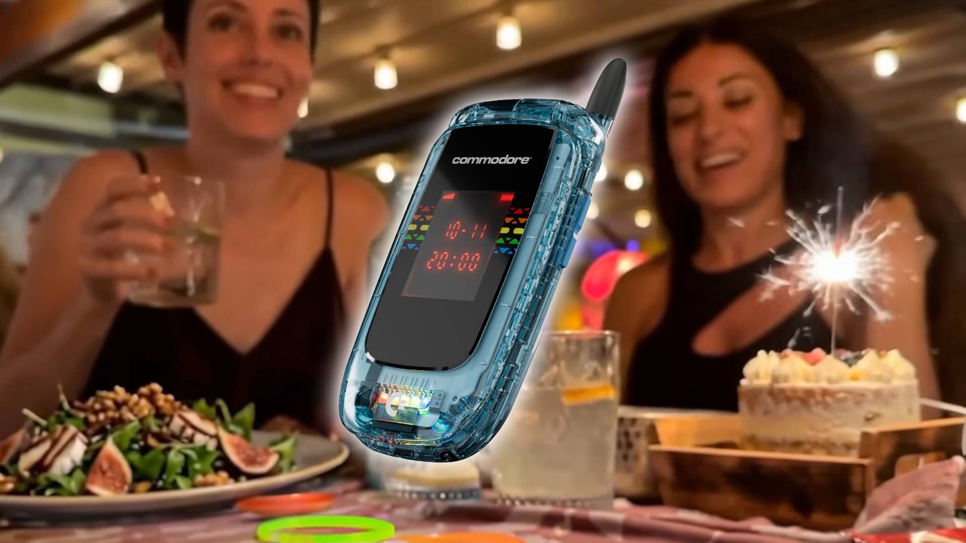 Commodore Callback 8020 flip-phone in transparent blue with promotional image of people at celebration party with cake and sparkler on right hand side.