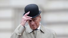 Prince Philip, Duke of Edinburgh raises his hat in his role as Captain General, Royal Marines, makes his final individual public engagement as he attends a parade to mark the finale of the 1664 Global Challenge, on the Buckingham Palace Forecourt on August 2, 2017 in London, England