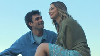 Jack looks at Heather as she sits looking over her shoulder