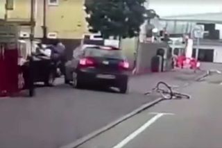 The man is hit by the driver of the car and is sent flying into the air