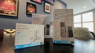 Ezviz video doorbell in boxes on black dining table