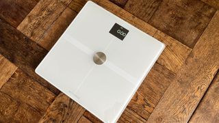 Withings Body Smart Scale in white on wooden floor