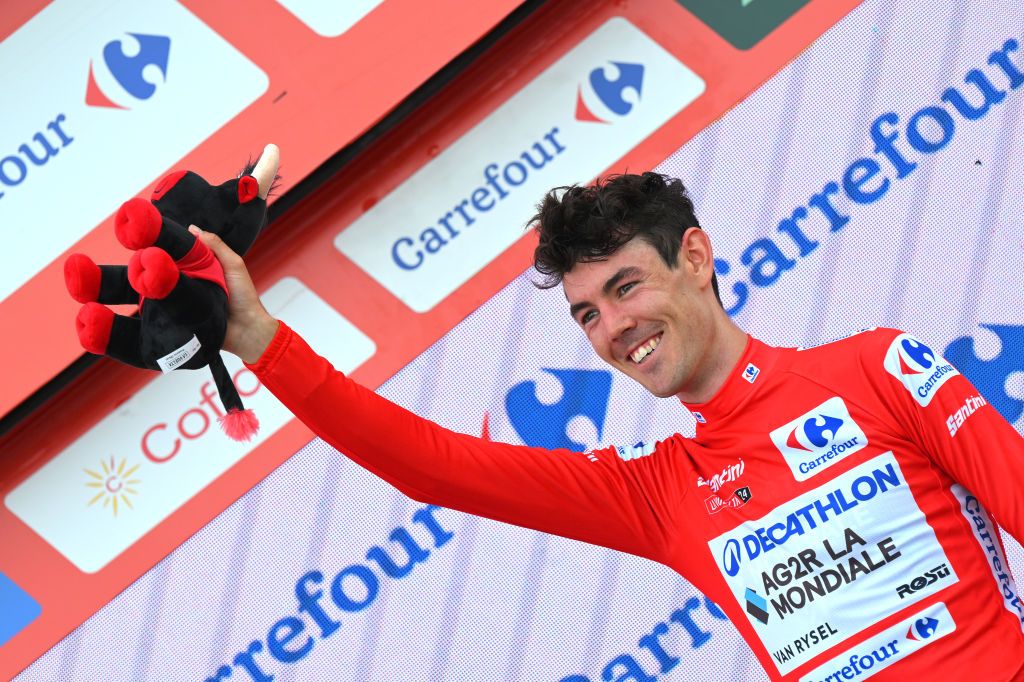 PUERTO DE ANCARES SPAIN AUGUST 30 Ben OConnor of Australia and Team Decathlon AG2R La Mondiale Red Leader Jersey celebrates at podium during the La Vuelta 79th Tour of Spain 2024 Stage 13 a 176km stage from Lugo to Puerto de Ancares 1659m UCIWT on August 30 2024 in Puerto de Ancares Spain Photo by Tim de WaeleGetty Images