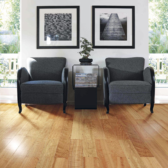 White walls with wooden flooring and armchair