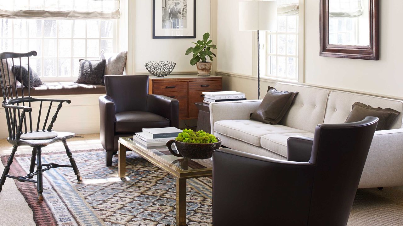 living room with beige sofa and brown chairs