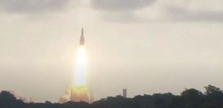 An Ariane 5 rocket carrying two communications satellites launches from Kourou, French Guiana, on July 30, 2021.